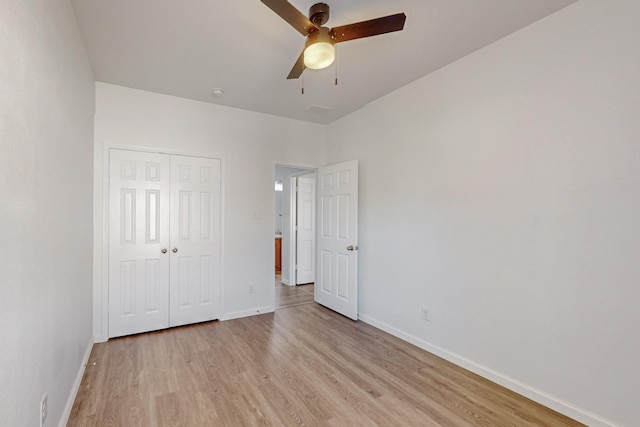 unfurnished bedroom with light wood finished floors, a closet, visible vents, ceiling fan, and baseboards