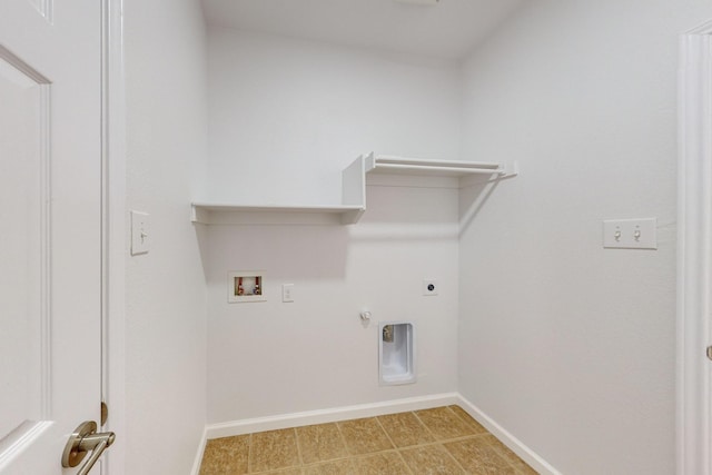 laundry area with washer hookup, hookup for a gas dryer, electric dryer hookup, laundry area, and baseboards