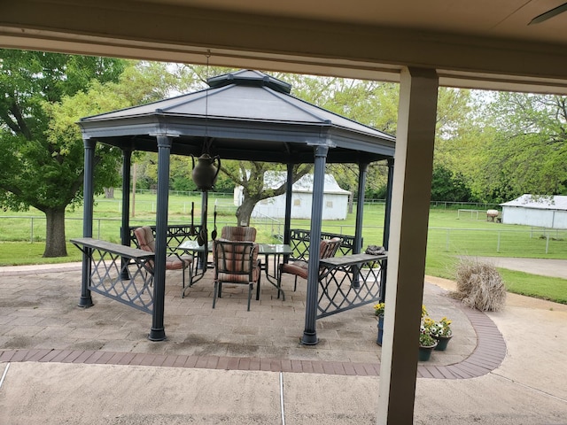 exterior space featuring a gazebo, a yard, a patio, and fence