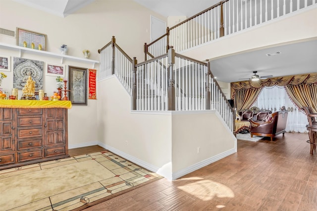 4513 Fairlake Dr, Garland, TX 75043 - foyer featuring wood finished floors, baseboards, a ceiling fan, and stairway