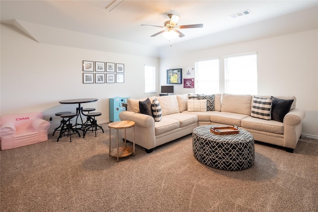 carpeted living area with ceiling fan, visible vents, and baseboards