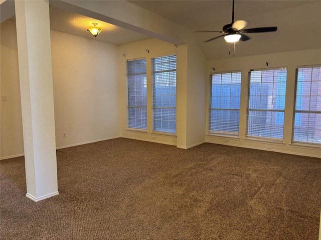 unfurnished room featuring a ceiling fan, baseboards, and dark carpet