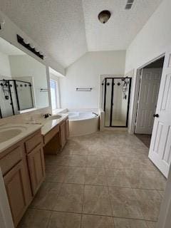 full bath with a shower stall, vanity, lofted ceiling, a bath, and a textured ceiling