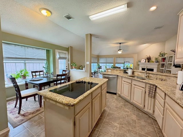 kitchen featuring visible vents, a sink, stainless steel dishwasher, a center island, and black electric cooktop