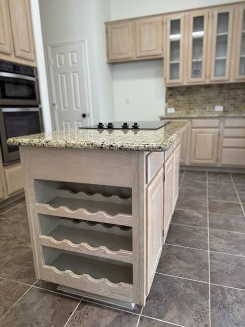 kitchen featuring a kitchen island, stainless steel double oven, open shelves, light brown cabinetry, and black electric cooktop