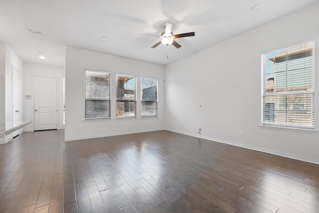 unfurnished room featuring dark wood-style floors, recessed lighting, visible vents, ceiling fan, and baseboards