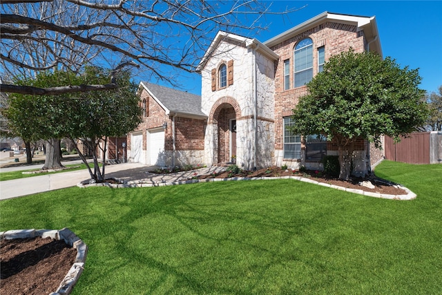 traditional home featuring stone siding, brick siding, a front lawn, and concrete driveway