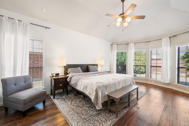 bedroom featuring dark wood-style floors, ceiling fan, and baseboards