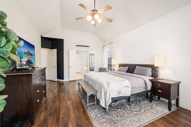 bedroom featuring dark wood-style flooring, lofted ceiling, a ceiling fan, connected bathroom, and baseboards