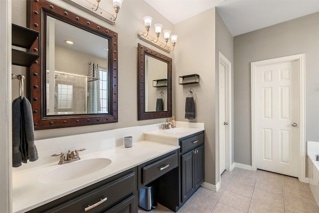 full bath featuring double vanity, a tile shower, a sink, and tile patterned floors