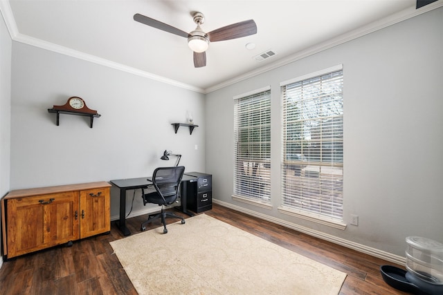 office featuring baseboards, visible vents, dark wood-style floors, ceiling fan, and crown molding