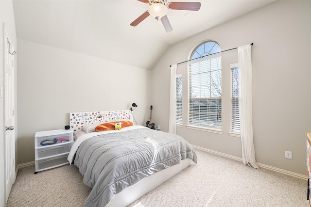 bedroom with carpet floors, baseboards, vaulted ceiling, and a ceiling fan