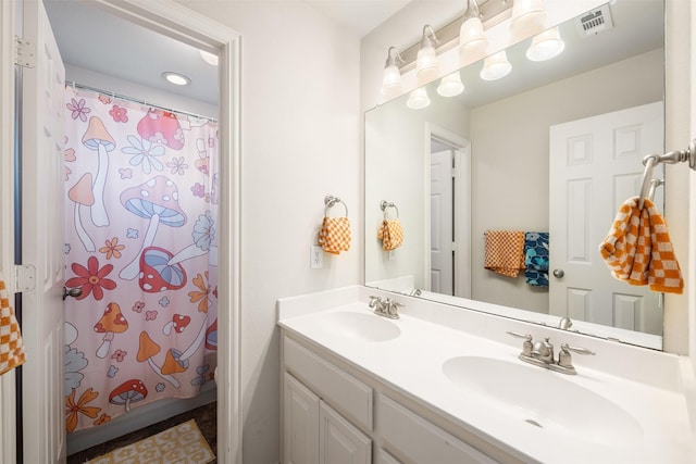 bathroom with double vanity, a sink, visible vents, and a shower with curtain