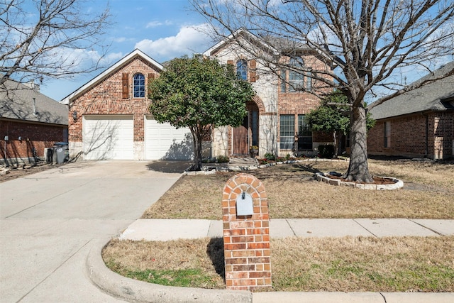 view of front of home featuring concrete driveway and brick siding