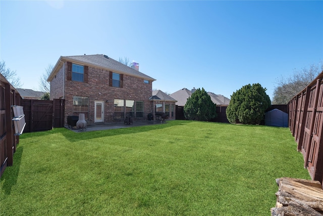 view of yard featuring a patio area and a fenced backyard