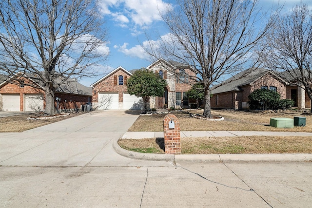 view of front of property with a garage, concrete driveway, and brick siding