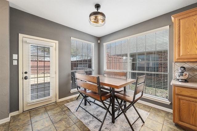 dining space with baseboards