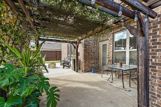 view of patio featuring fence and a pergola