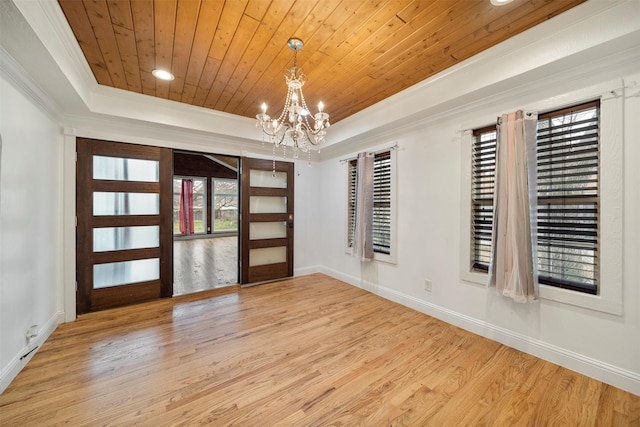 314 S Hastings St, Irving, TX 75060 - interior space featuring crown molding, wood finished floors, a raised ceiling, baseboards, and a notable chandelier