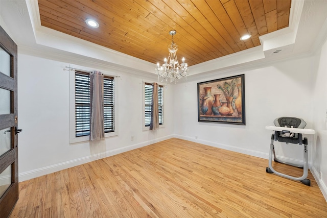314 S Hastings St, Irving, TX 75060 - unfurnished room featuring a tray ceiling, an inviting chandelier, wood finished floors, crown molding, and wooden ceiling