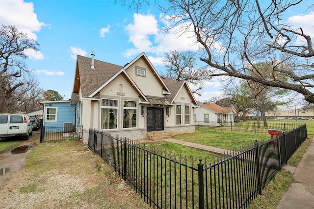 view of front of house featuring a fenced front yard, stone siding, roof with shingles, stucco siding, and a front yard