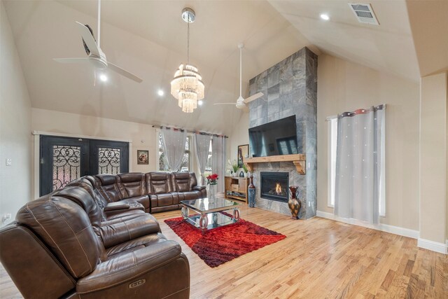 314 S Hastings St, Irving, TX 75060 - living room featuring visible vents, high vaulted ceiling, wood finished floors, ceiling fan, and a fireplace