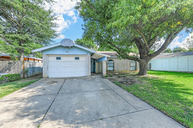 ranch-style house with a garage, brick siding, fence, driveway, and a front yard