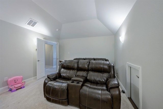 carpeted cinema with vaulted ceiling, visible vents, and baseboards