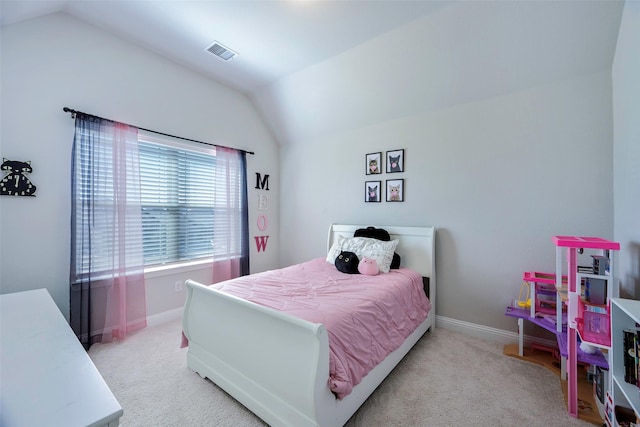 carpeted bedroom with vaulted ceiling, visible vents, and baseboards