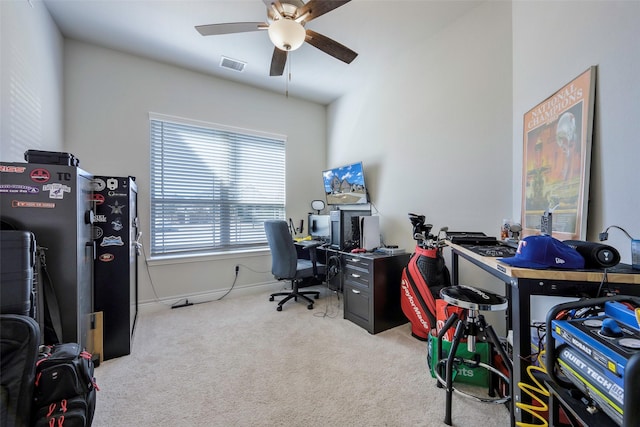 home office featuring baseboards, carpet, visible vents, and a ceiling fan