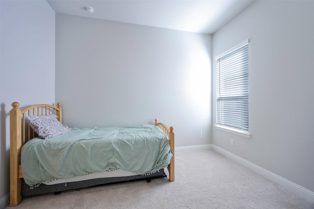 carpeted bedroom with baseboards