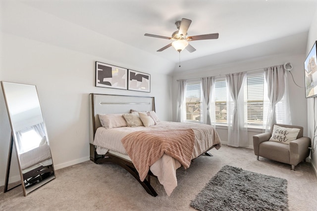 bedroom with baseboards, ceiling fan, and light colored carpet