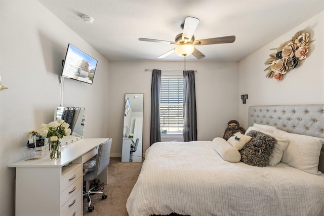 bedroom featuring a ceiling fan and light colored carpet