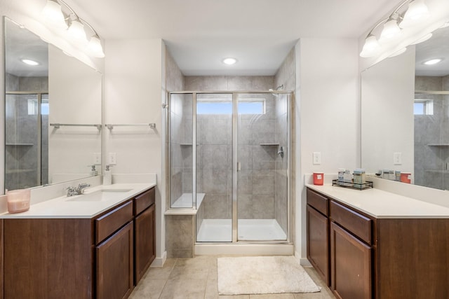 bathroom featuring a stall shower, vanity, and tile patterned floors