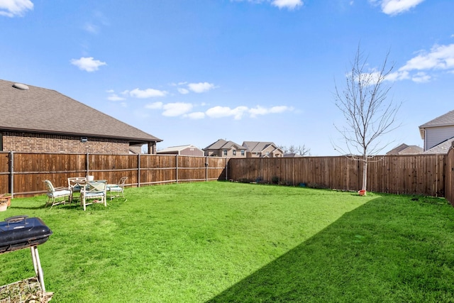 view of yard with a fenced backyard