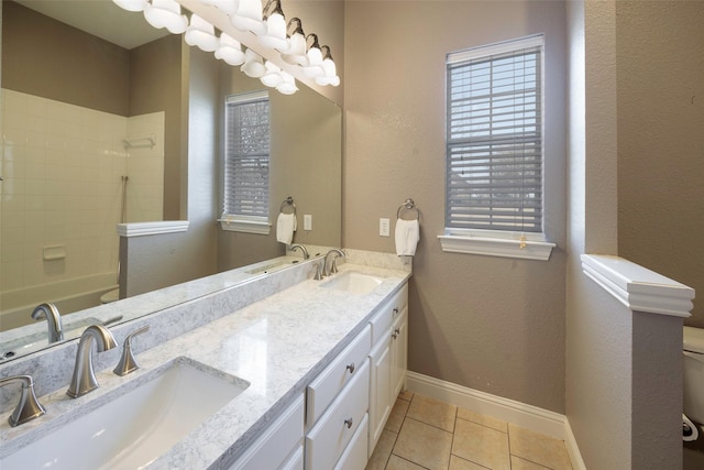 full bathroom featuring tile patterned flooring, a sink, toilet, and baseboards