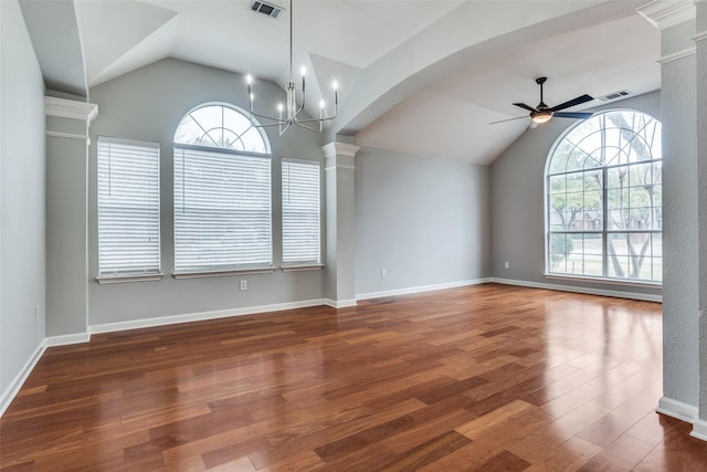 interior space featuring a healthy amount of sunlight, visible vents, wood finished floors, and ceiling fan with notable chandelier