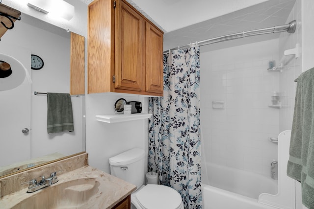 bathroom featuring vanity, shower / bath combo with shower curtain, and toilet