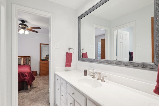 ensuite bathroom with ensuite bathroom, a ceiling fan, vanity, and crown molding