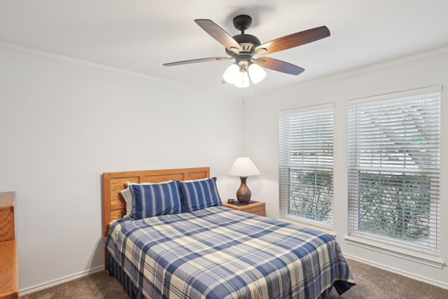 carpeted bedroom featuring ornamental molding, baseboards, and a ceiling fan