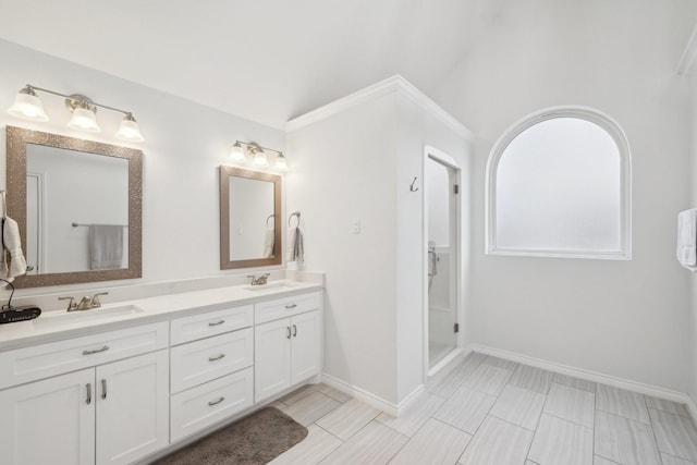 bathroom featuring double vanity, baseboards, and a sink