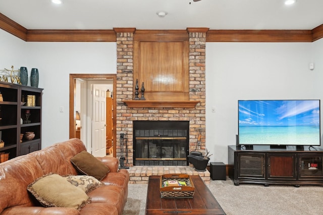 living area with ornamental molding, carpet, recessed lighting, and a brick fireplace