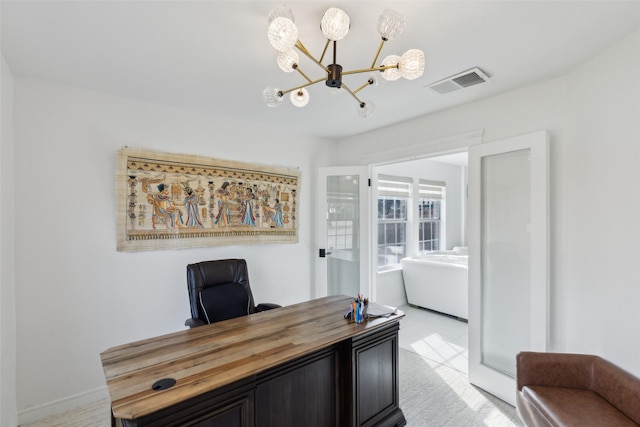 home office featuring visible vents and a notable chandelier