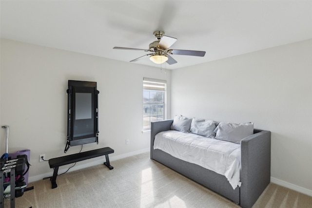 bedroom with a ceiling fan, carpet flooring, and baseboards