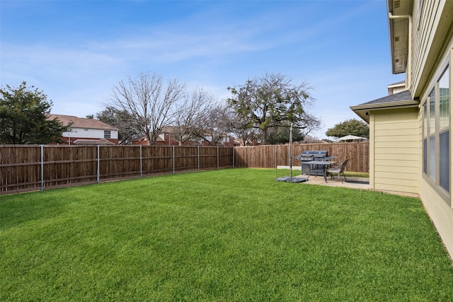 view of yard with a patio and a fenced backyard