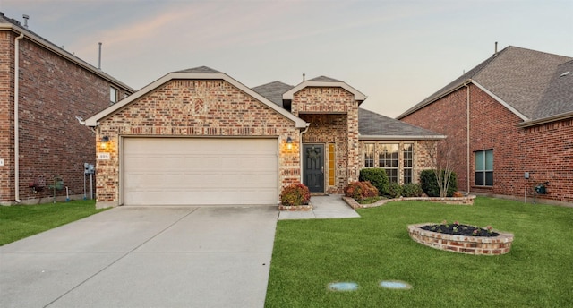 view of front of house with driveway, a front yard, a shingled roof, a garage, and brick siding