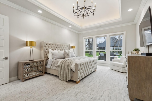 bedroom with ornamental molding, carpet, a tray ceiling, and an inviting chandelier