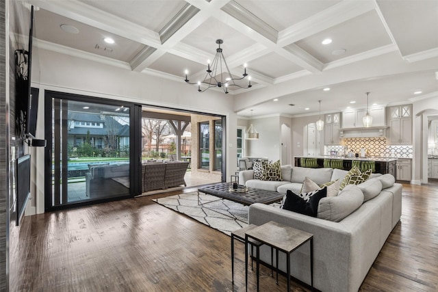 living room with recessed lighting, coffered ceiling, beamed ceiling, and wood finished floors