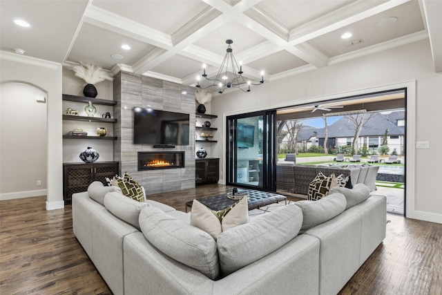 living area with dark wood-style floors, coffered ceiling, a fireplace, and beamed ceiling