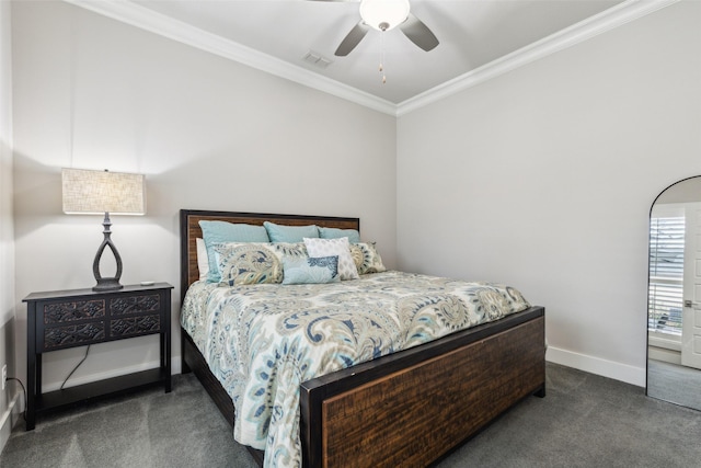 bedroom with baseboards, visible vents, a ceiling fan, crown molding, and carpet flooring